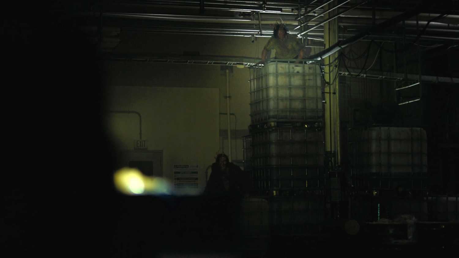Stalkers visible in flashlight in HBO's The Last of Us, season 2, episode 5.