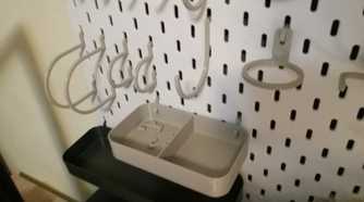 close-up shot of a parts tray and various hooks on an IKEA pegboard