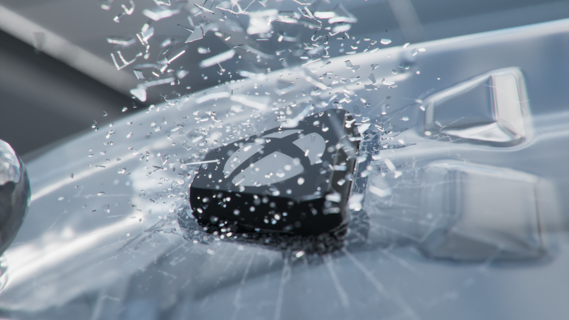 The Xbox button, breaking through glass