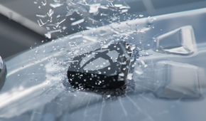The Xbox button, breaking through glass