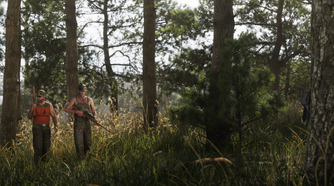 Two men walking through a forrest