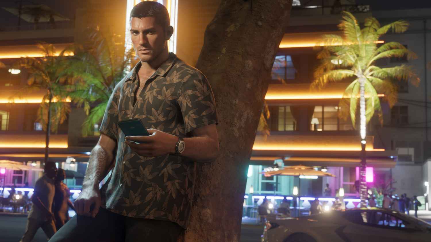 Jason standing against a tree in the city