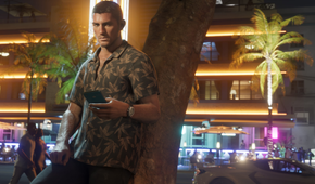 Jason standing against a tree in the city