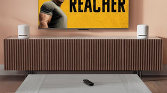 Amazon Fire TV Stick 4K on living room with TV on