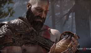 Kratos holding his wife's ashes in 2018's God of War.