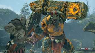 Kratos fighting an ogre in 2018's God of War.