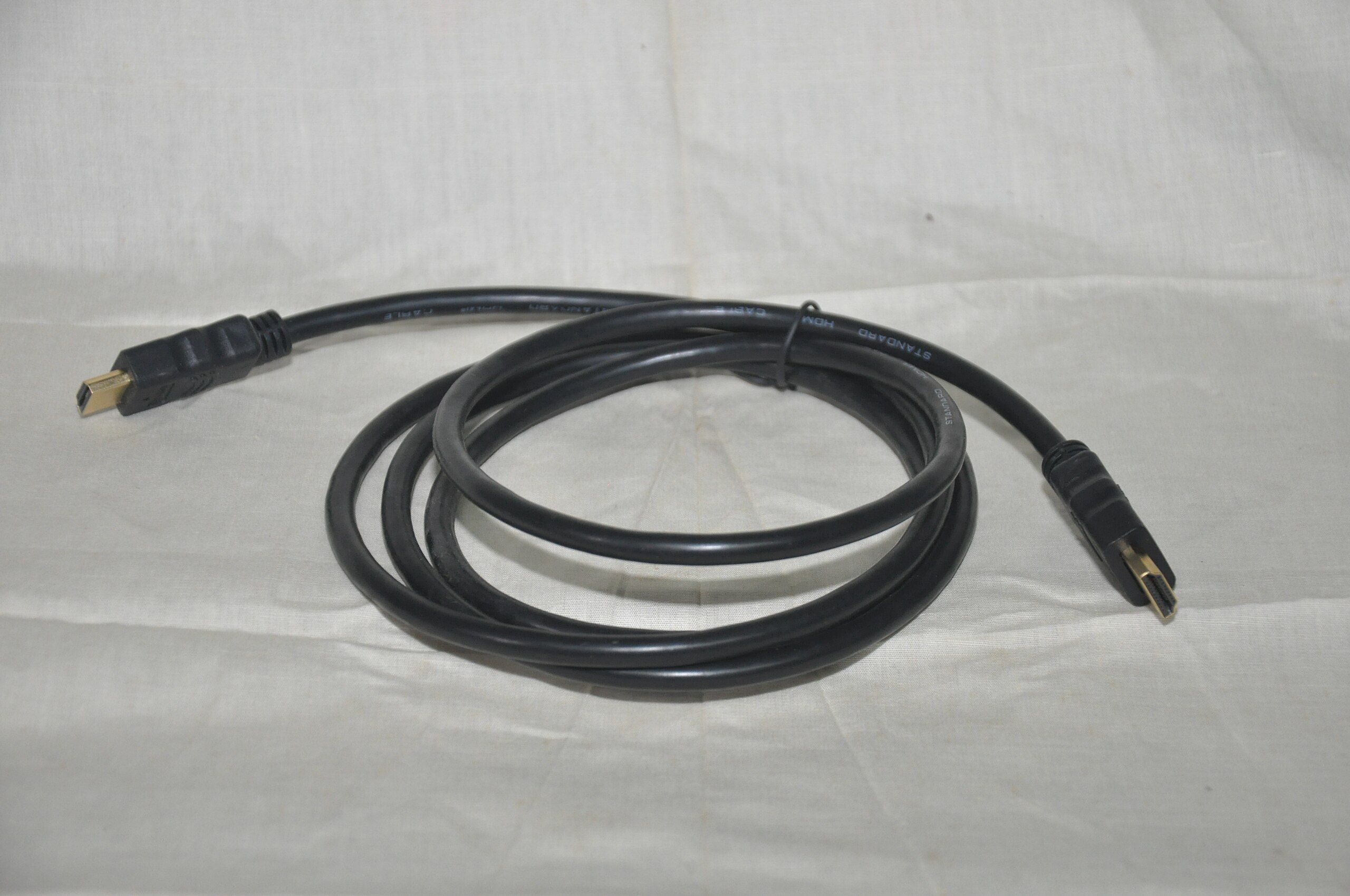 A black HDMI cable with gold-plated connectors