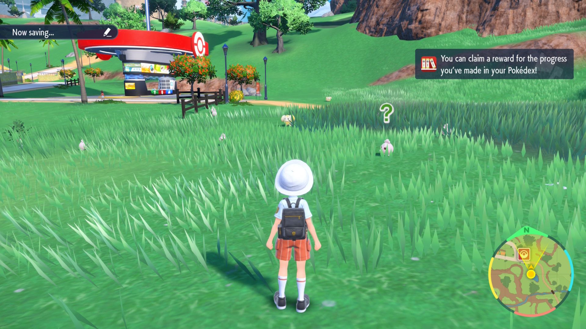 Pokémon Scarlet showing a player in a field with some wild Pokémon