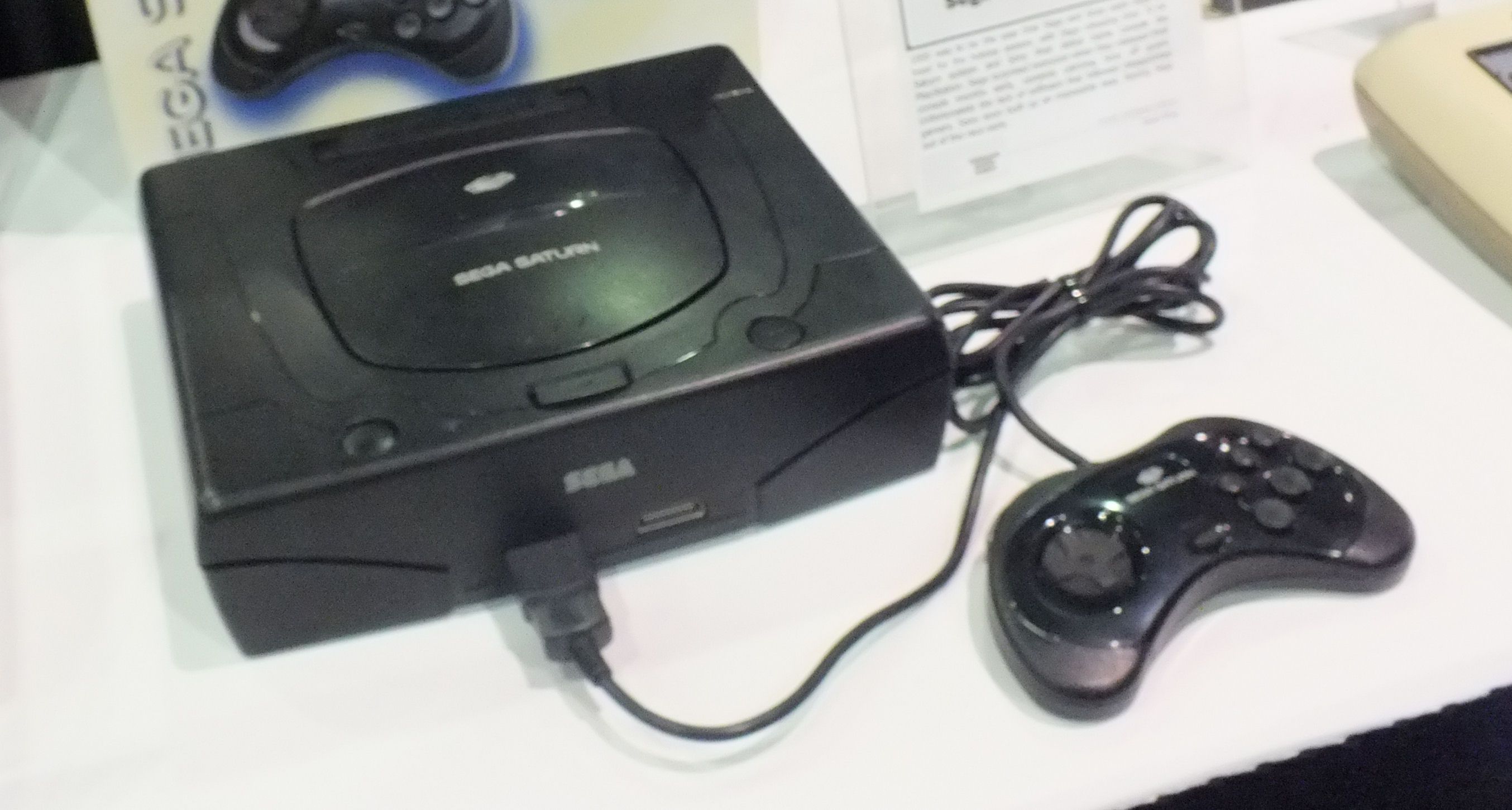 Sega Saturn console with controller.