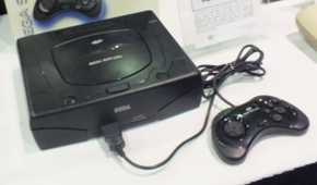 Sega Saturn console with controller.
