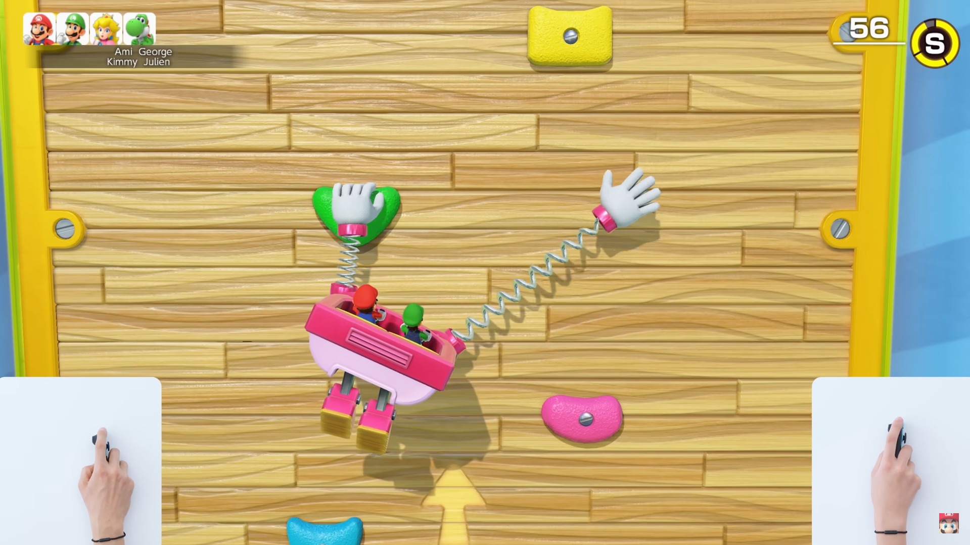 Screenshot of Super Mario Party Jamboree Nintendo Switch 2 Edition during a rock-climbing minigame with a small view of the player suing one of the Joy-Con 2 as a mouse