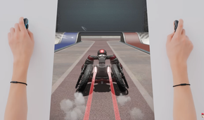Screenshot of Drag x Drive showing a player making a dragging motion with the Joy-Con 2 to push a wheelchair forward in the game