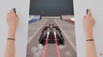 Screenshot of Drag x Drive showing a player making a dragging motion with the Joy-Con 2 to push a wheelchair forward in the game
