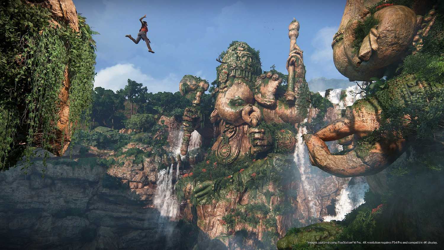 Chloe jumping in front of a huge Ganesh statue in Uncharted: The Lost Legacy.