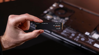 person holding WD_BLACK SN7100 NVMe Internal Gaming SSD