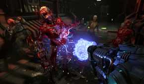 Shooting a zombie with a plasma rifle in Doom Eternal.