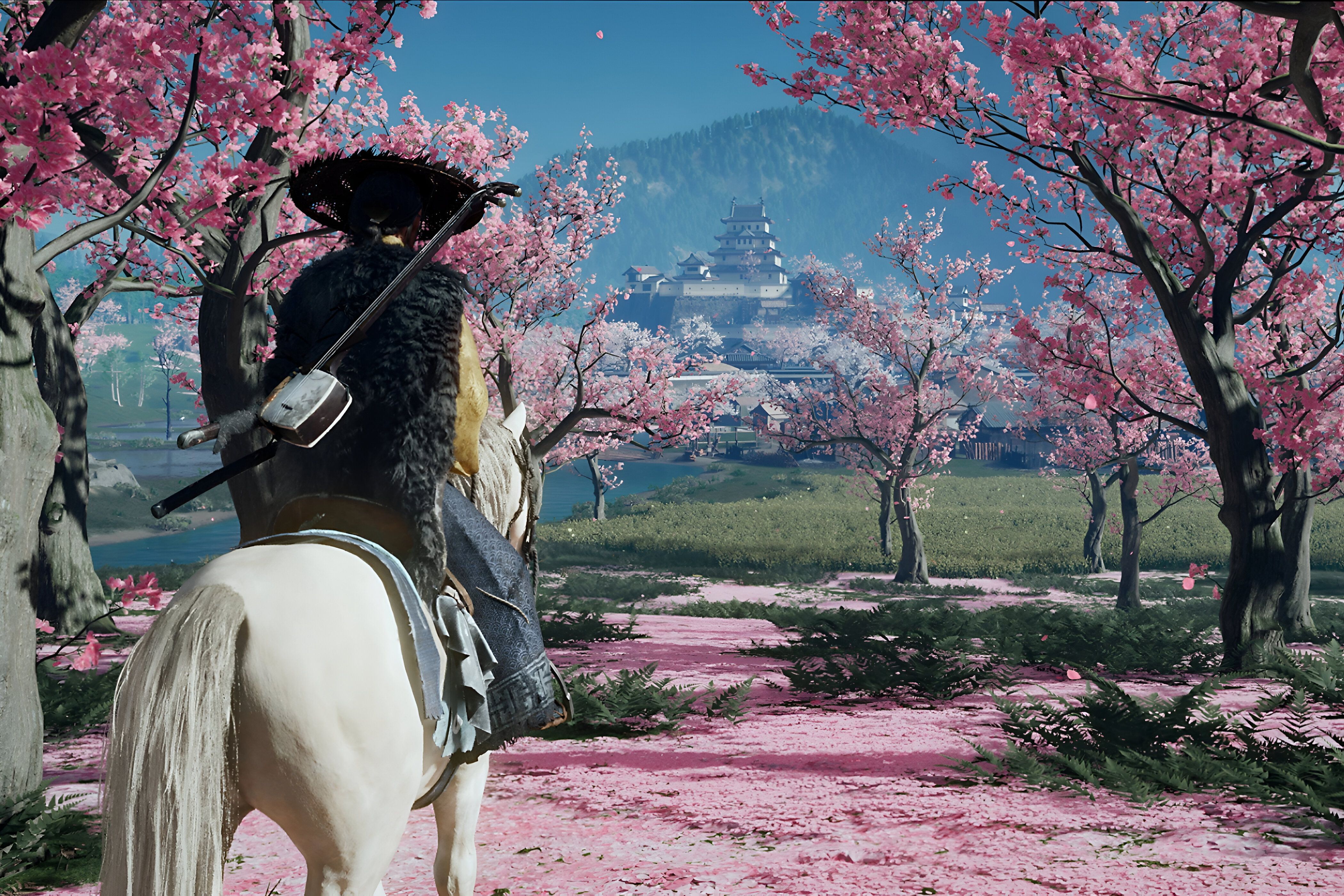 An image from Ghost of Yotei, showing Atsu among cherry blossoms.