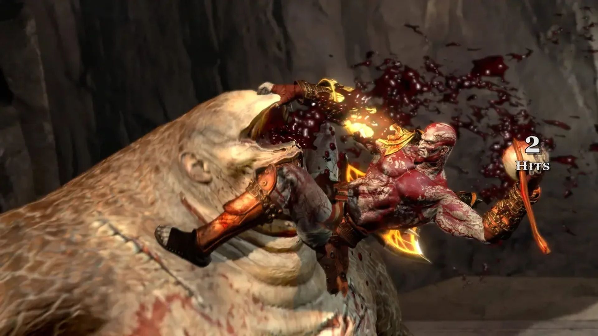 A screenshot of Kratos fighting a cyclops in God of War III
