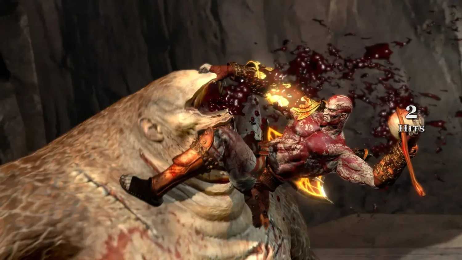 A screenshot of Kratos fighting a cyclops in God of War III