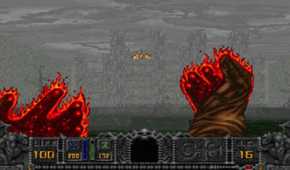 A screenshot of the Cleric shooting fire magic in Hexen: Beyond Heretic