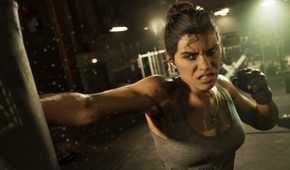 Screenshot of Lucia Caminos in GTA VI, training to box in a gym.