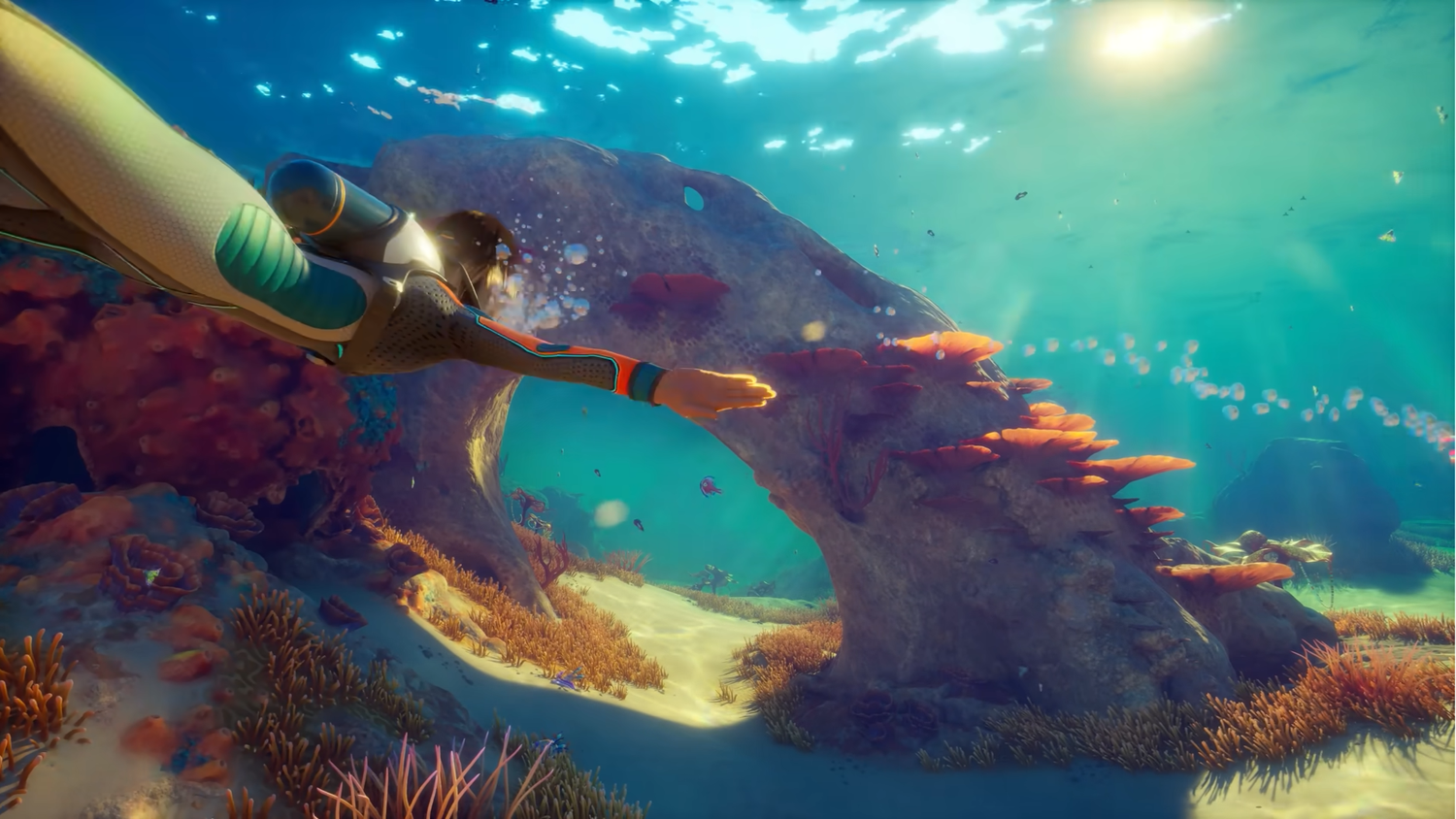 A player swimming through an arch in Subnautica 2