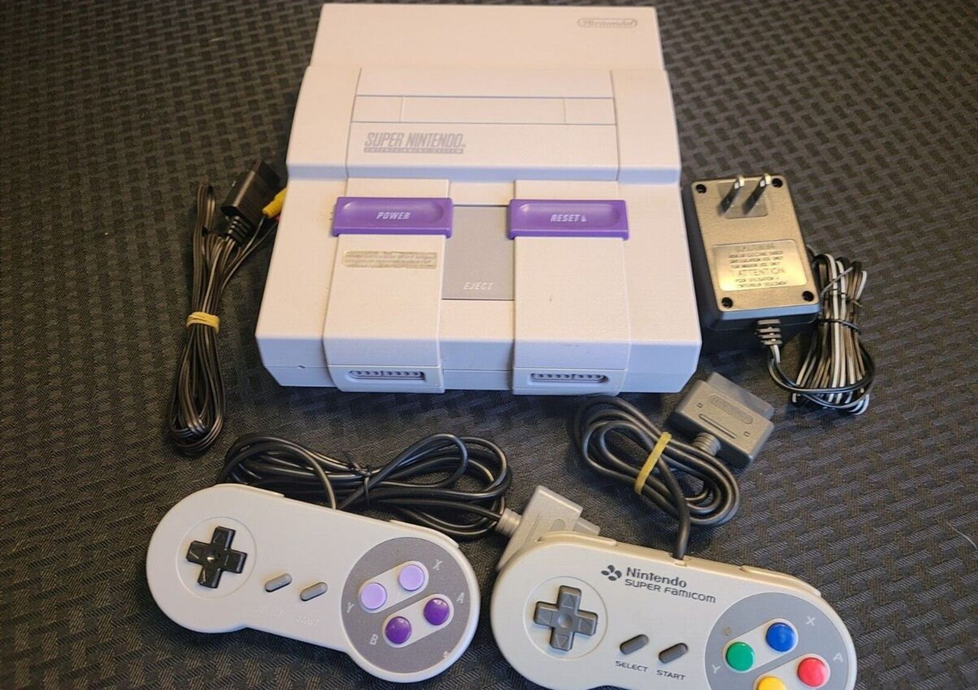 A shot of the Super Nintendo console with controllers