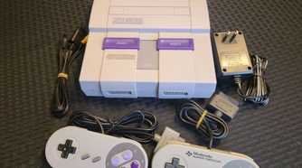 A shot of the Super Nintendo console with controllers