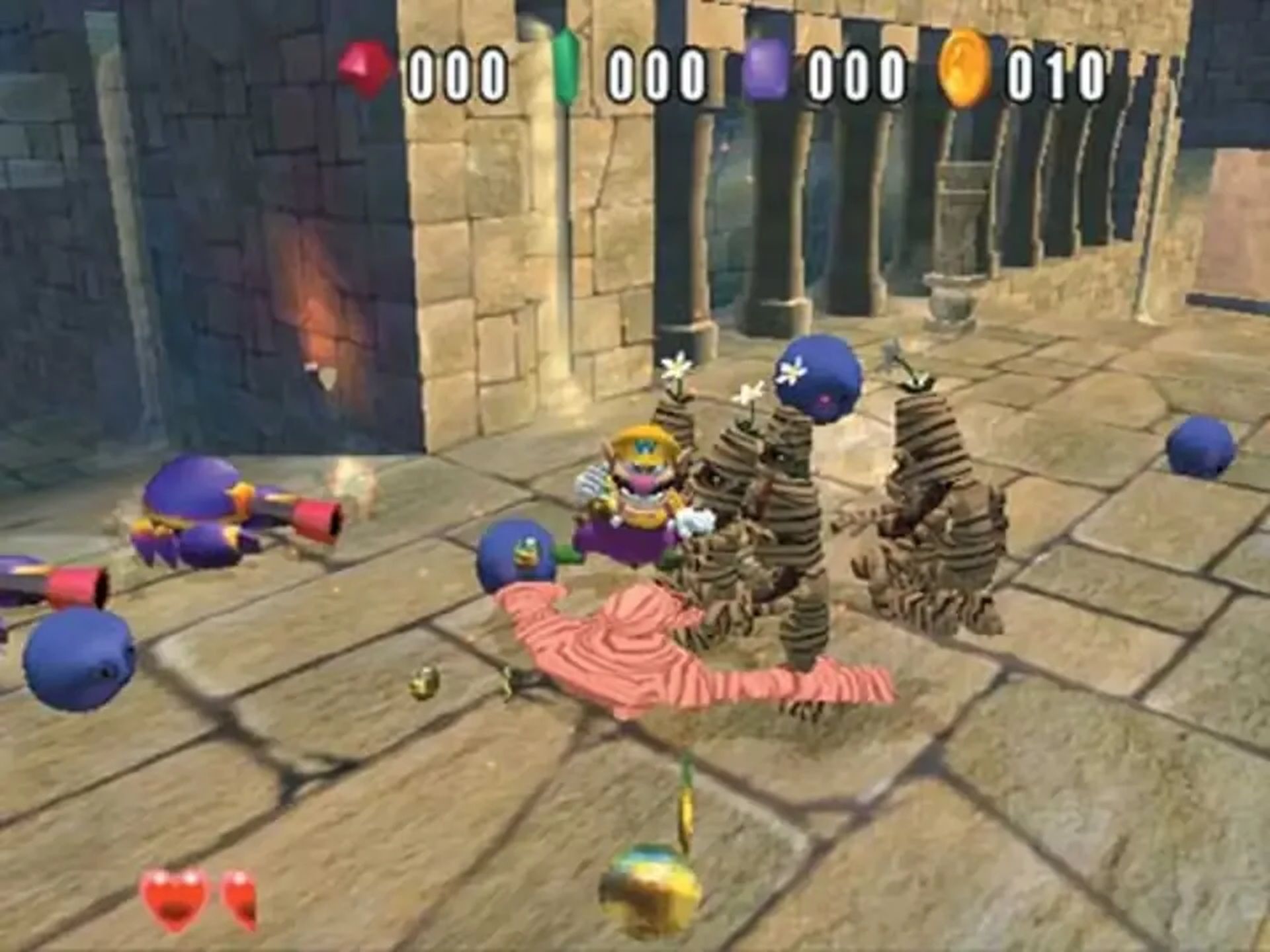 A screenshot of fighting enemies in Wario World.