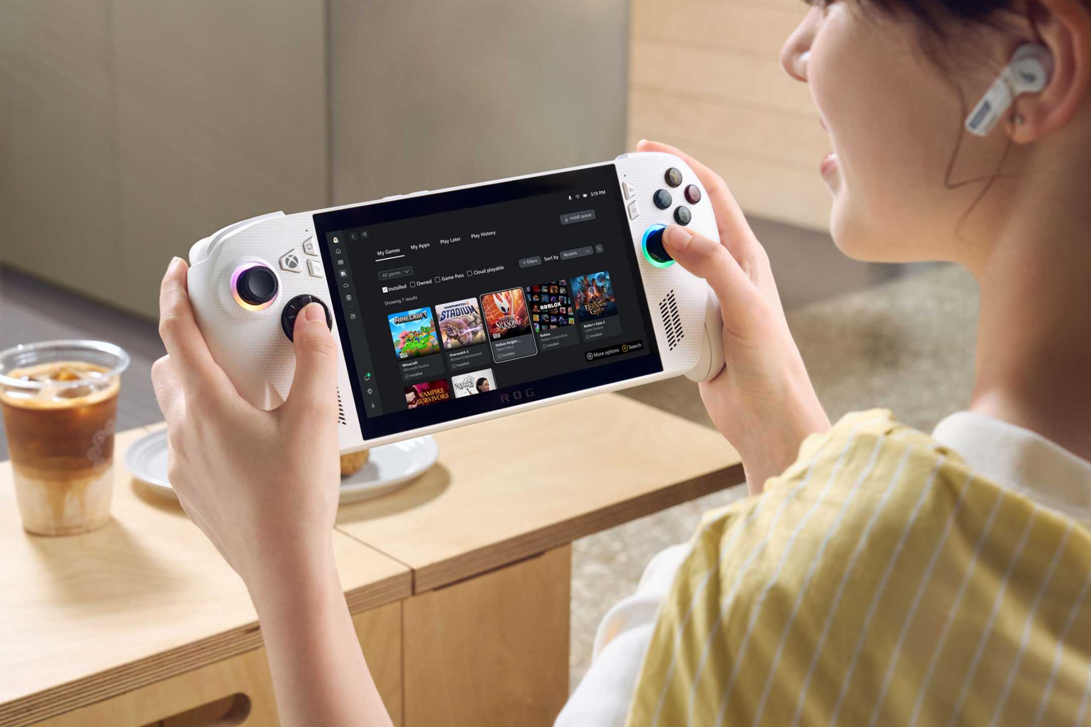 A woman using the ROG Xbox Ally.