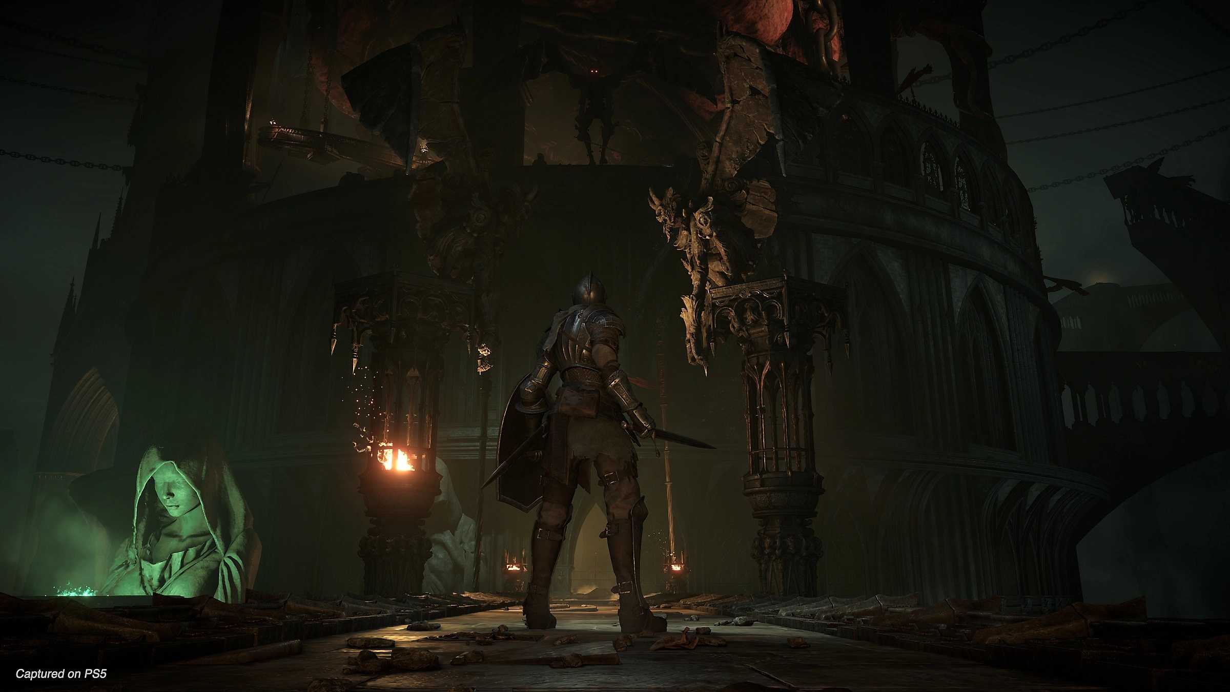 A shadow gargoyle atop a ledge in Demon's Souls.