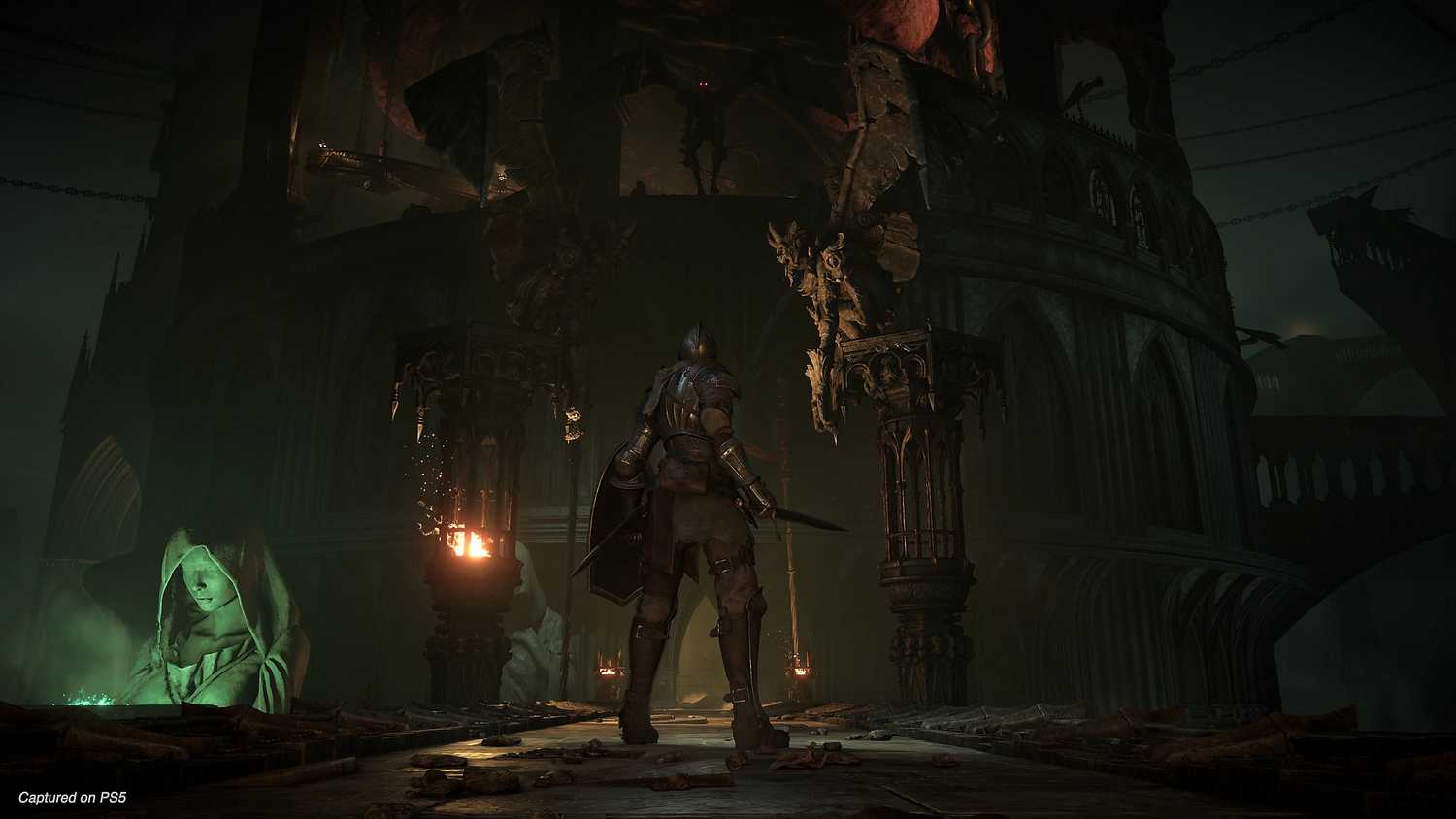 A shadow gargoyle atop a ledge in Demon's Souls.