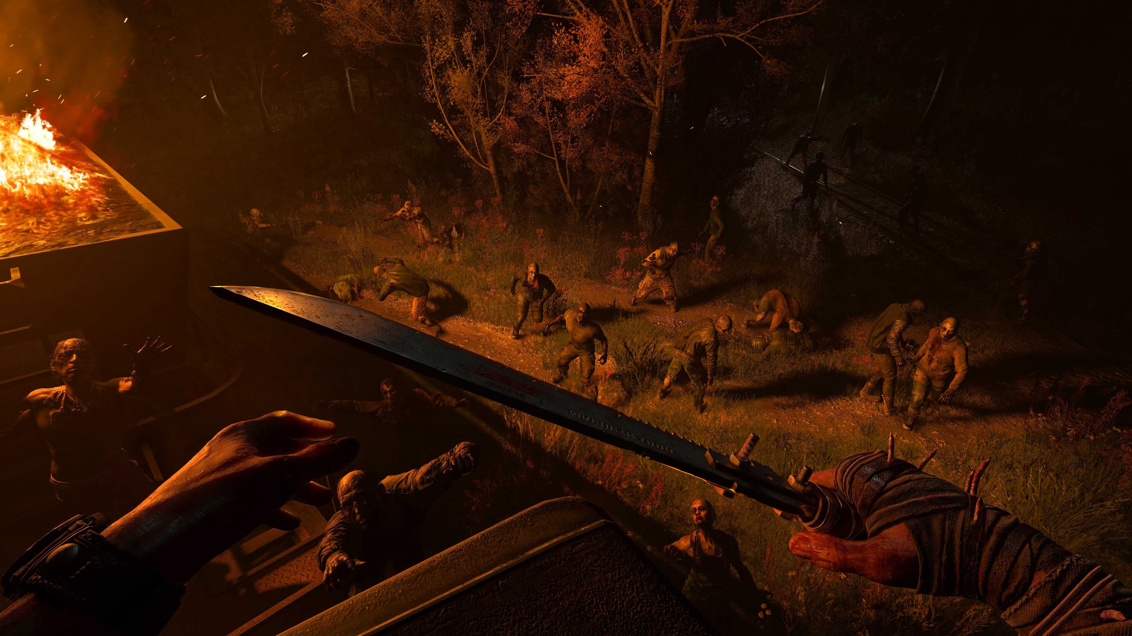 The player facing a horde of infected at night next to a burning vehicle in Dying Light: The Beast.