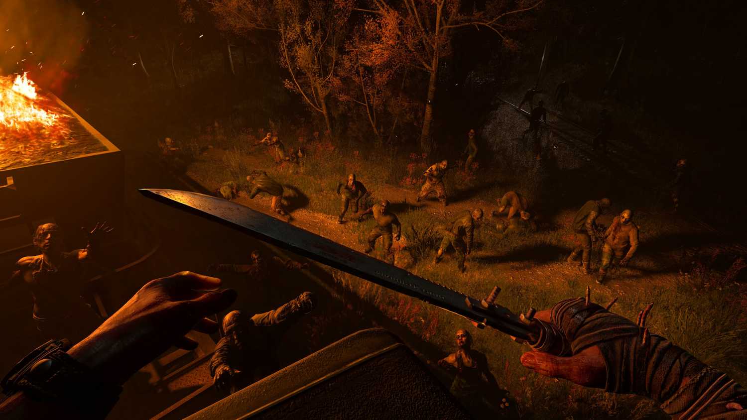 The player facing a horde of infected at night next to a burning vehicle in Dying Light: The Beast.