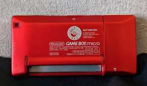 The backside of a red Game Boy Micro from the Japan Pokemon Center.
