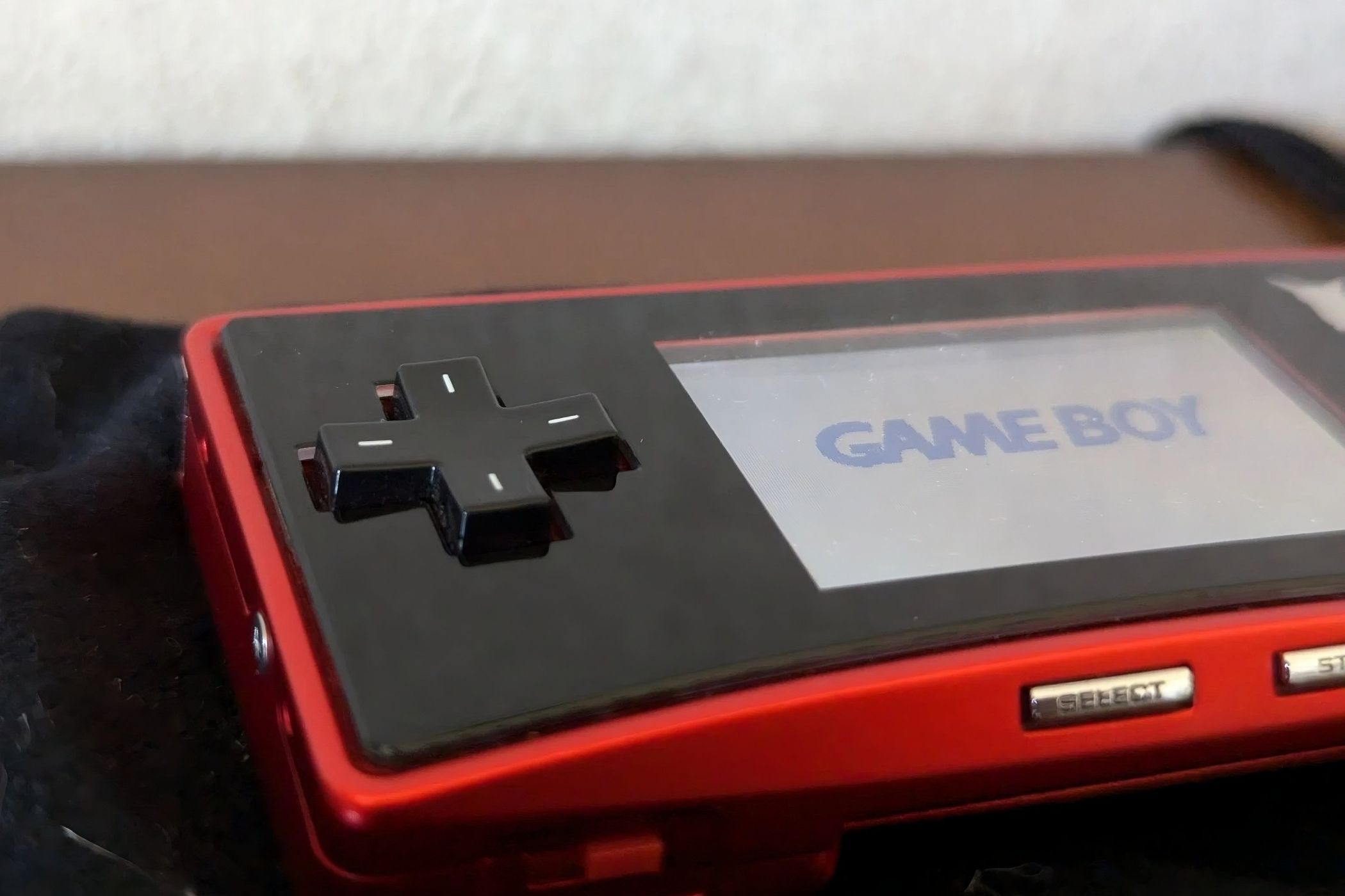 A red Game Boy Micro from the Japan Pokemon Center.