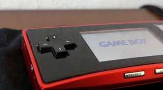 A red Game Boy Micro from the Japan Pokemon Center.