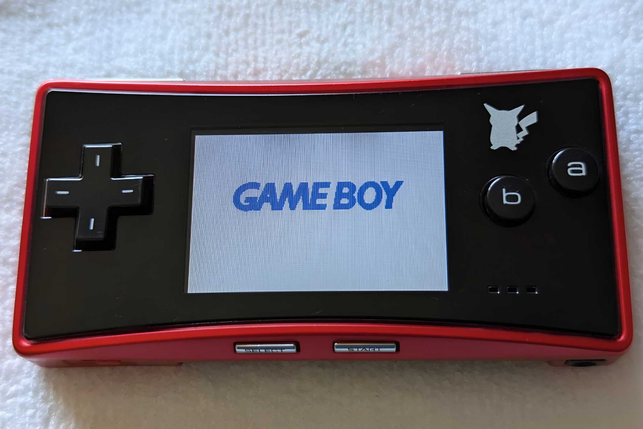 A red Game Boy Micro from the Japan Pokemon Center.