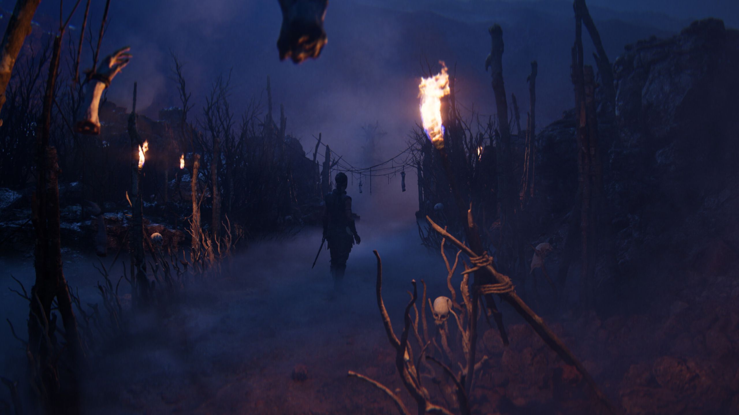 Senua walking through sticks and bones in Senua's Saga: Hellblade II.