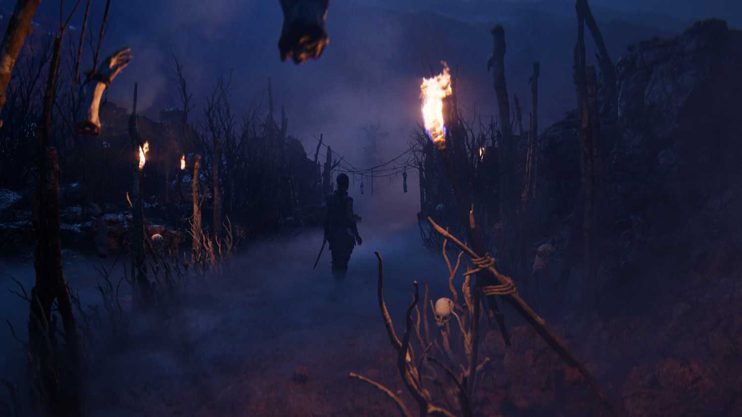 Senua walking through sticks and bones in Senua's Saga: Hellblade II.