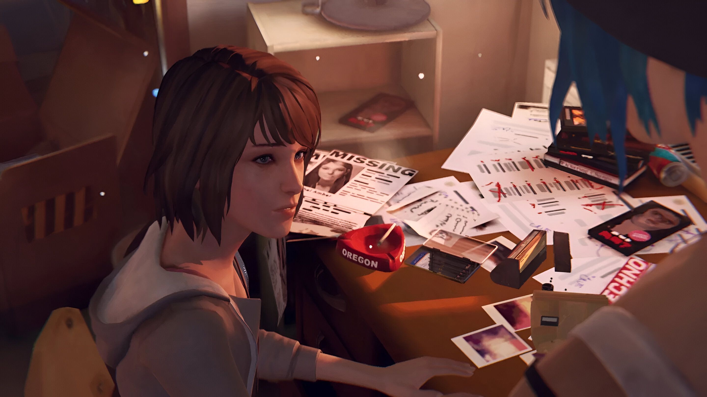 Max sitting at a desk with strewn papers in Life is Strange.