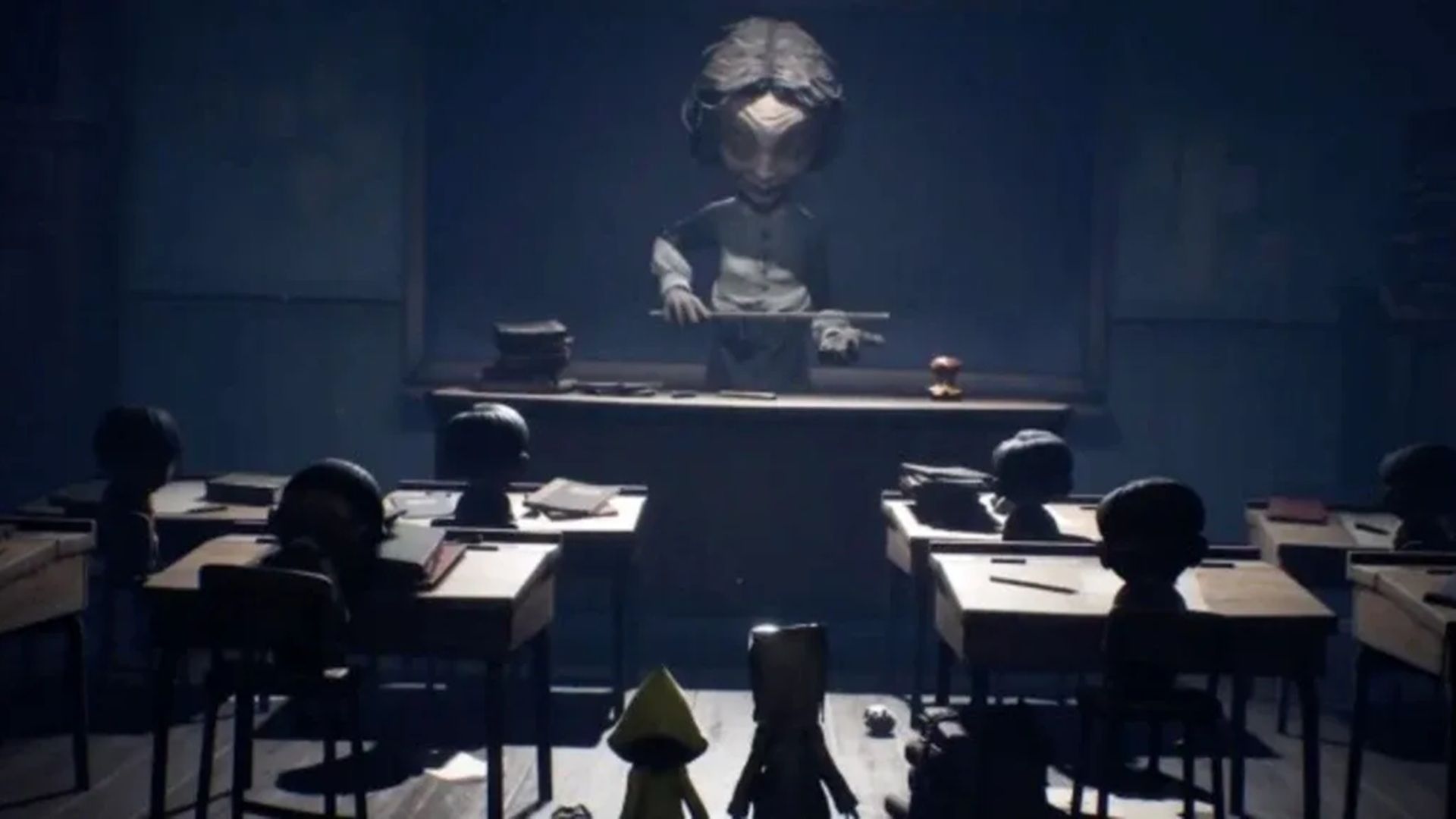 A screenshot of a towering figure over a class of small kids in Little Nightmares 2