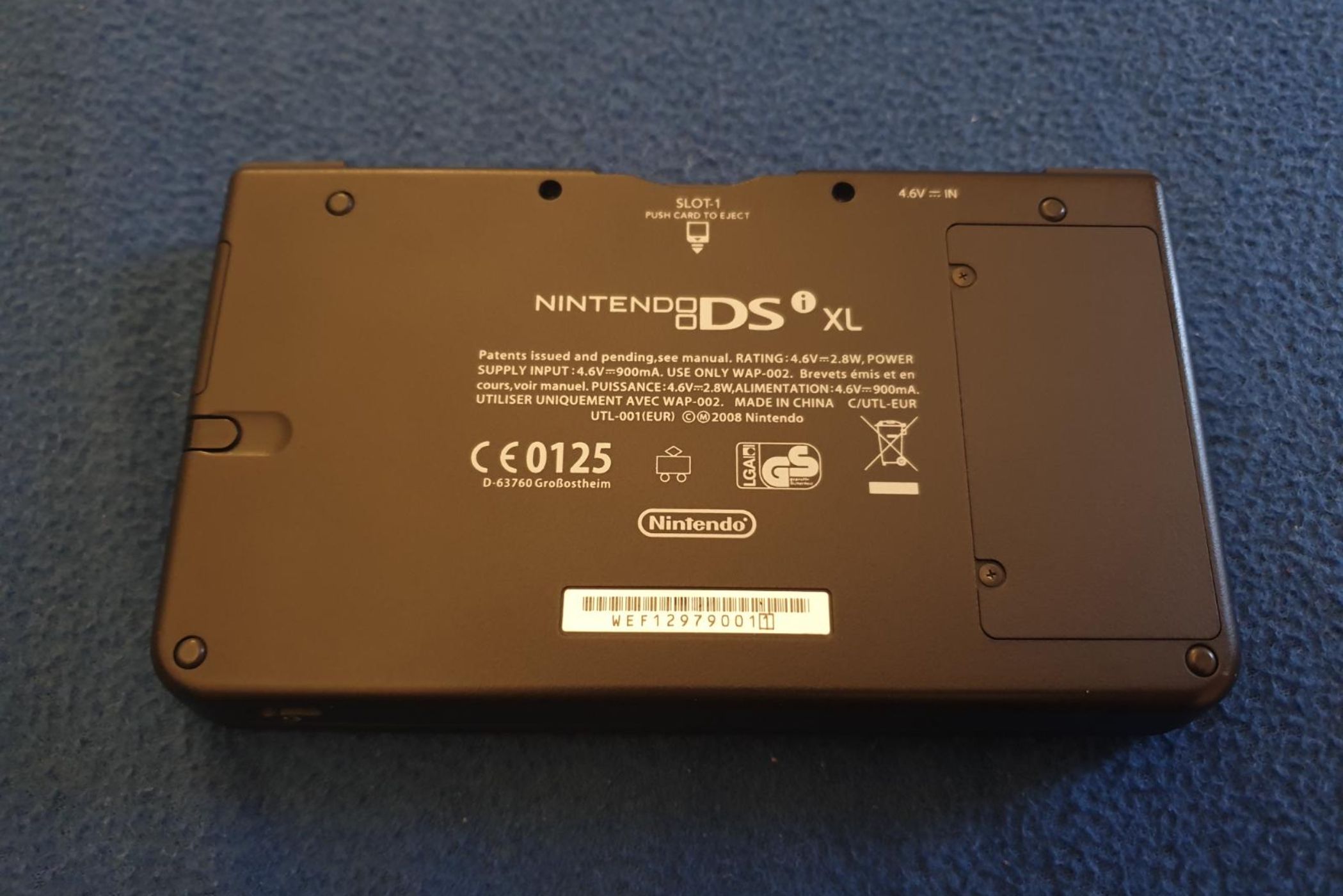 The backside of a Nintendo DSi XL from the 2010 Pokemon World Championships.