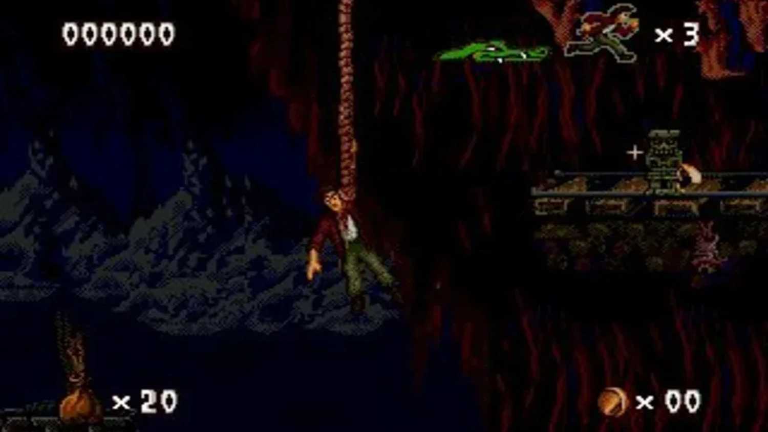 A screenshot of Harry dangling from a rope in Pitfall: The Mayan Adventure