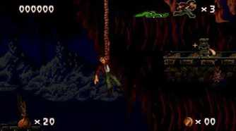 A screenshot of Harry dangling from a rope in Pitfall: The Mayan Adventure