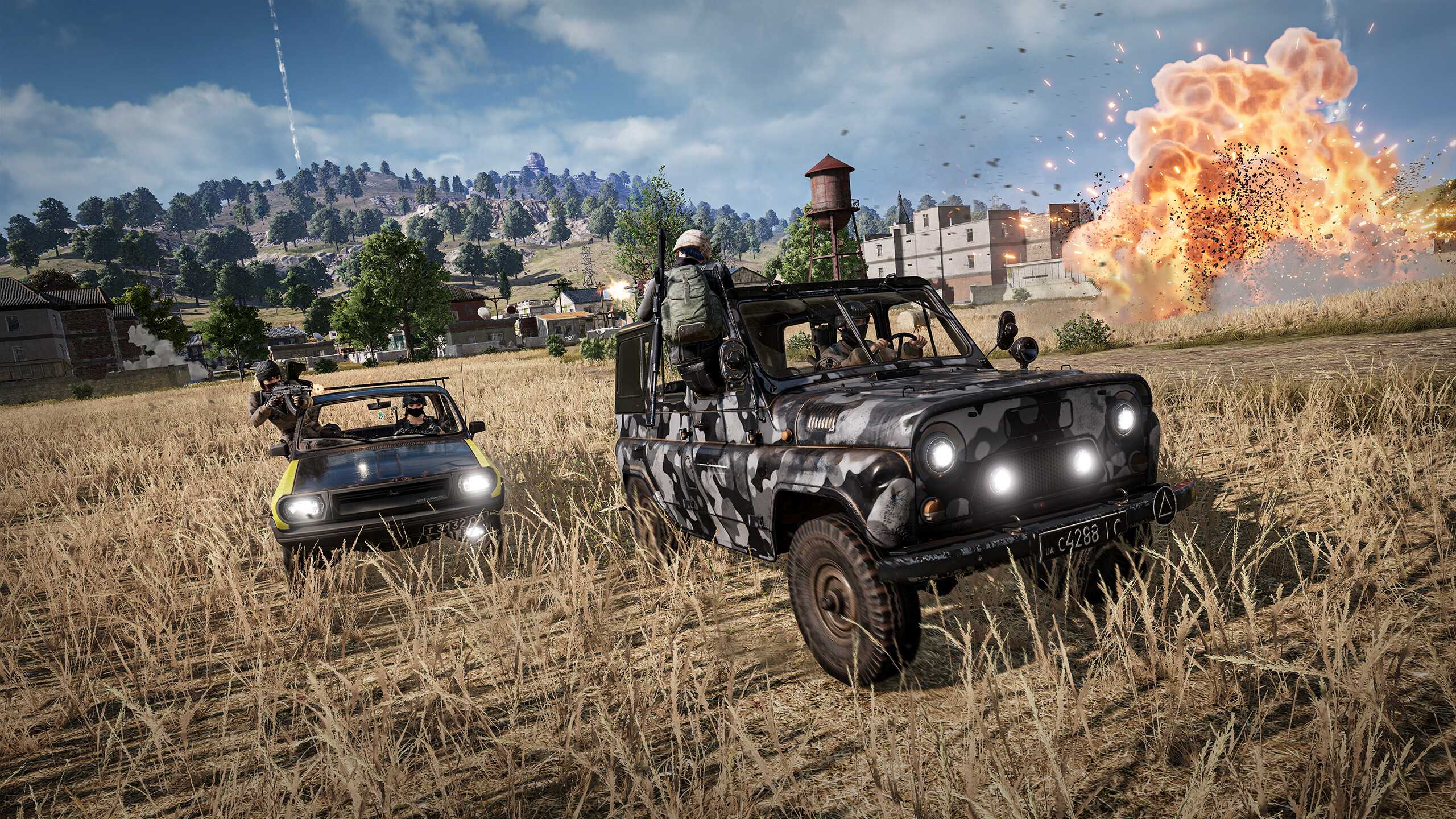 Two cars in a chase in PlayerUnknown's BattleGrounds.