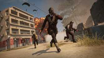 A trio of players running from an exploding building in PlayerUnknown's BattleGrounds.