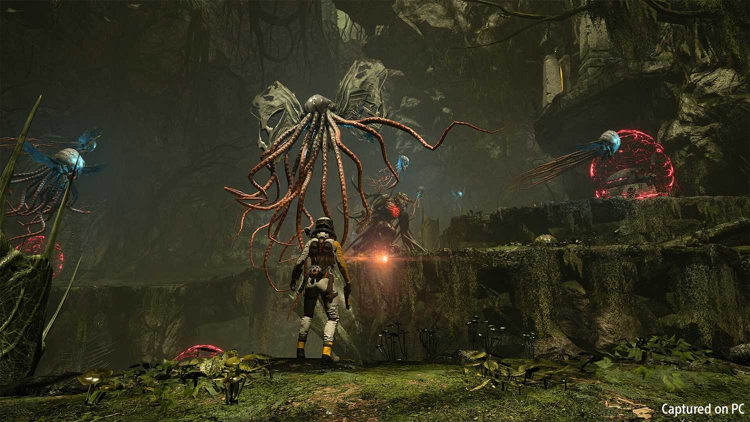 Selene facing off against flying Lovecraftian creatures in Returnal.