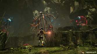Selene facing off against flying Lovecraftian creatures in Returnal.
