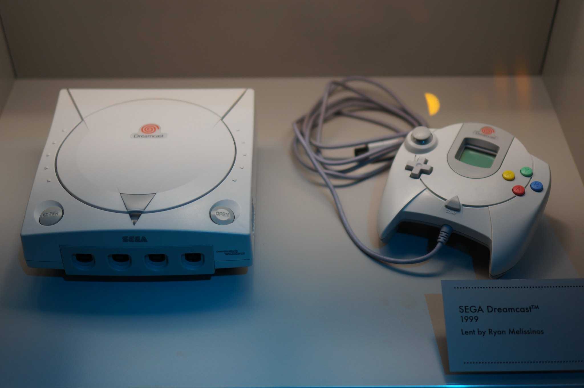 A Sega Dreamcast and its controller.